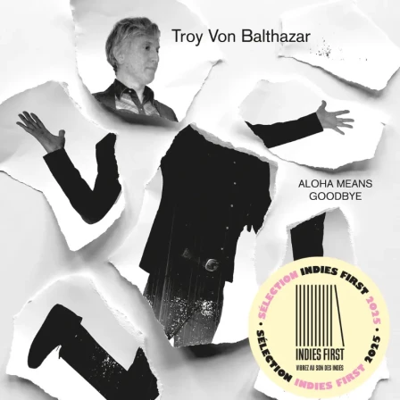 Black and white album cover, featuring a photo of the singer cut into several pieces, with Troy Von Balthazar and the title Aloha Means Goodbye. And a round sticker &amp;quot;Indies First 2025&quot;